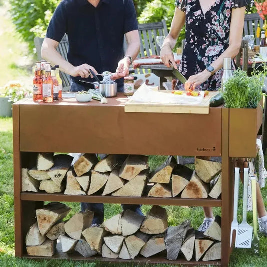 Brown metal outdoor Barbecook Buddy workstation corten steel with firewood storage shelves and wooden cutting board on top
