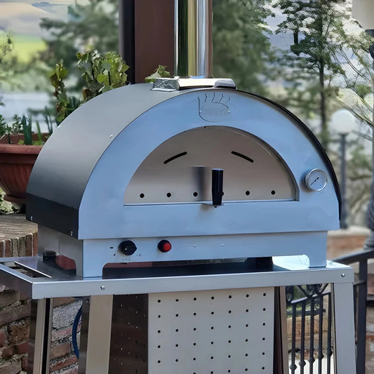 Stainless steel dome-shaped Clementi Clementino gas pizza oven with polished finish and black accents in two colours