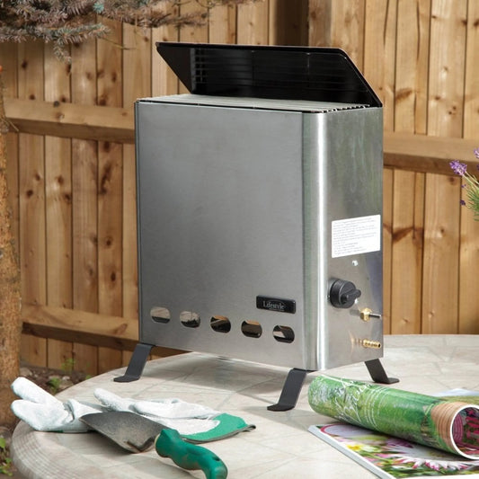 Stainless steel Eden Pro 4.2kW greenhouse heater with black lid and adjustable control knob for outdoor use