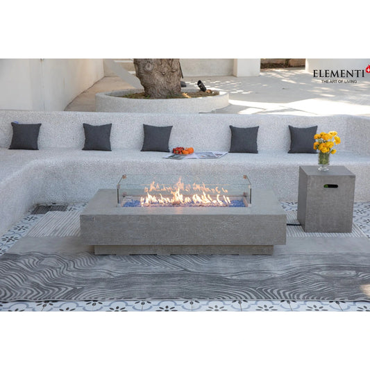 Gray concrete Elementi Plus Riviera fire table with glass enclosure and blue flameless fuel bed 16 kW OFG415LG