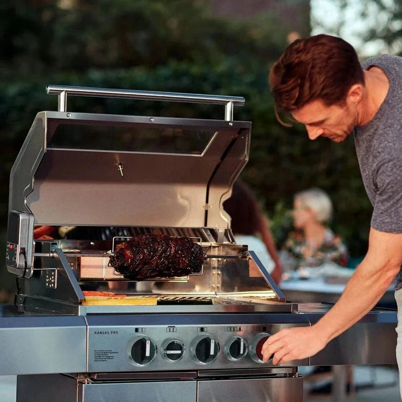 Stainless steel Enders Kansas Pro 3 Sik Turbo gas barbecue with rotisserie holding charred dark roast