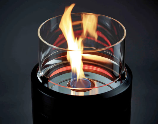 Modern black cylindrical ethanol fireplace with clear glass top and flickering flame enders large black nova led flame patio heater