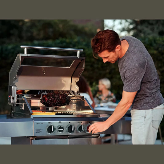 Stainless steel Enders Monroe 3 4 gas BBQ rotisserie with control knobs and rotisserie setup for outdoor grilling
