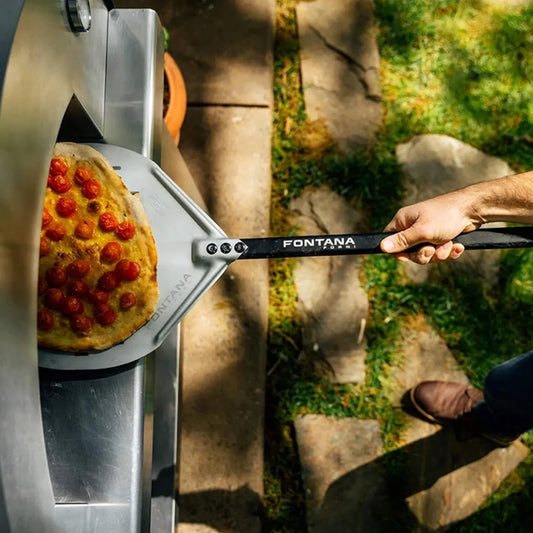 Fontana forni pizza peel with sleek black handle and metallic silver blade engraved with brand name for wood-fired pizza oven