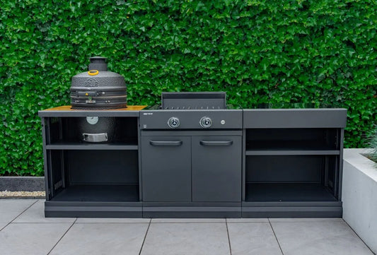 Black ceramic grllr ember classic 18 inch kamado grill with textured surface and yellow lid accent on wooden countertop