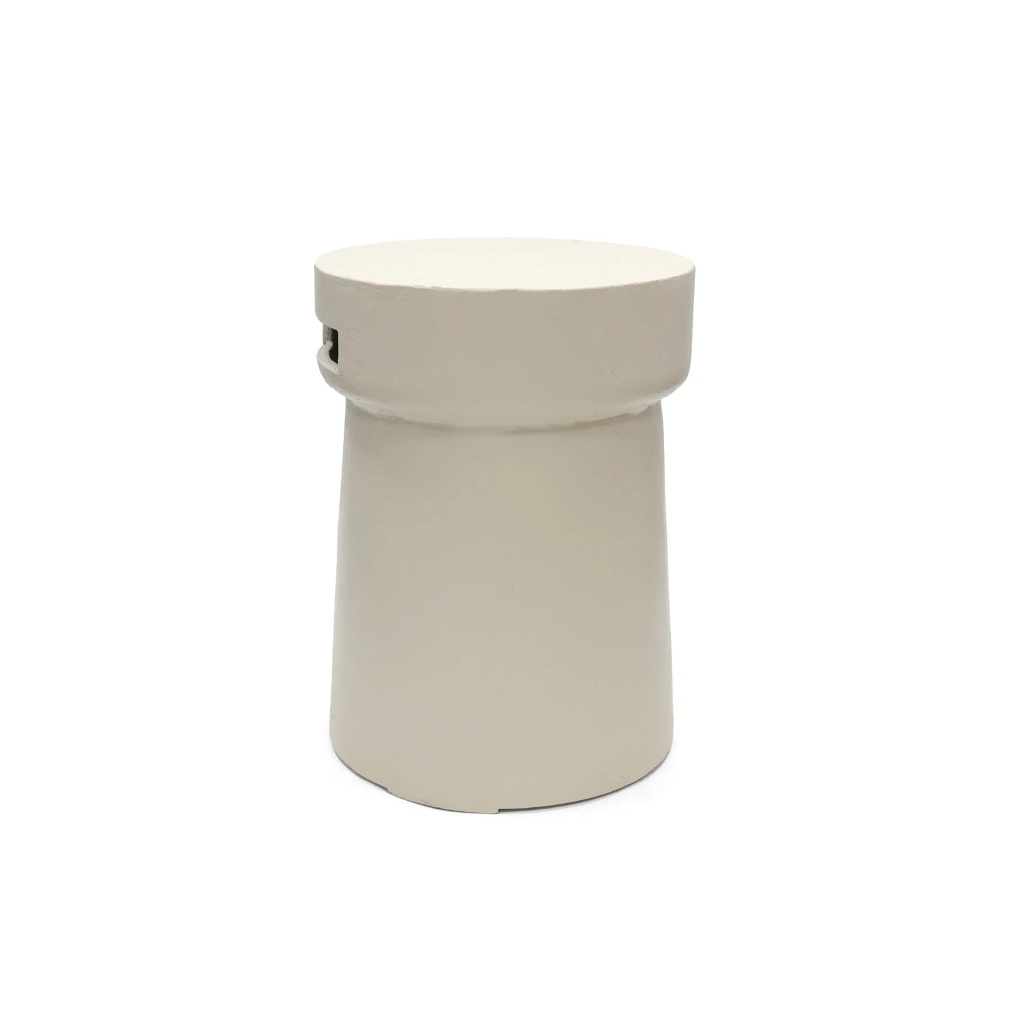 Cream-colored cylindrical cork side table with smooth matte finish and subtle top edge indentation for happy cocooning enclosure