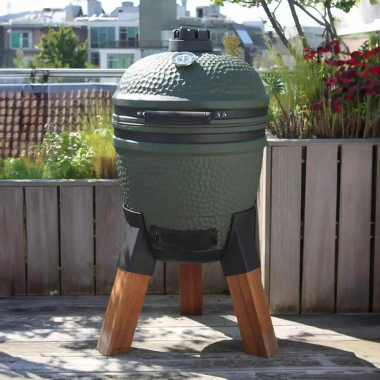 Olive green ceramic kamado grill with black accents and wooden legs in moddern kamado pedestal aluminium ma131 model