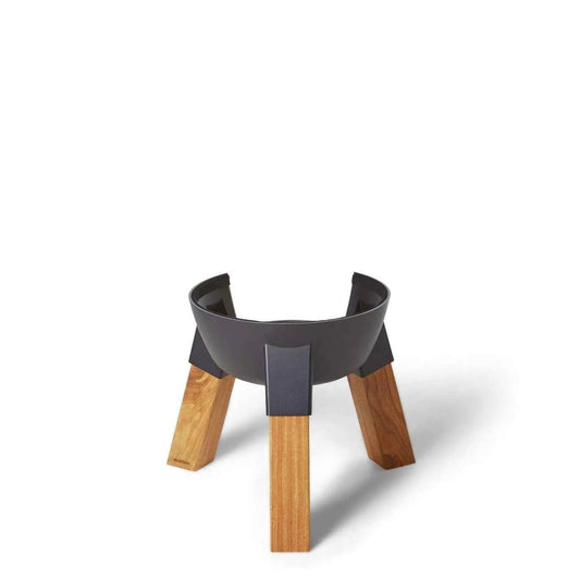 Black metal fire pit with natural wood modern kamado pedestal legs for sturdy outdoor cooking support