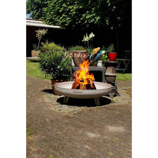 Moodz feet and handle fire bowl with matte gray finish and three sturdy legs made of corten and stainless steel