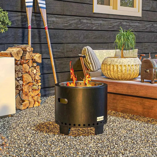 Outsunny metal wood-burning smokeless fire pit in black with matte finish and perforated base with side handle