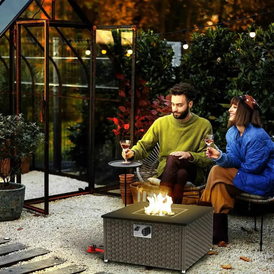 Brown woven wicker rattan gas fire pit table with square design and visible flame smokeless grey outsunny