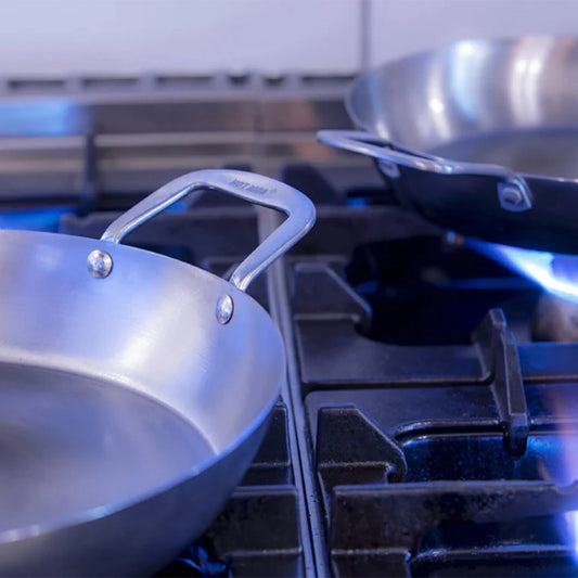Silver stainless steel hot wok paella pan 35cm with curved handle and riveted construction for even cooking