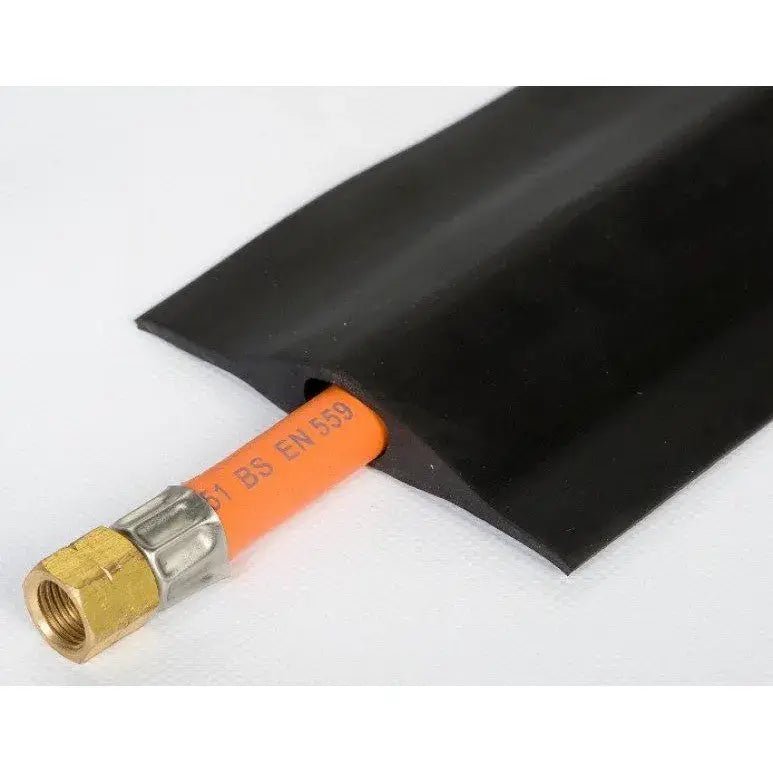 Black rubber conduit sleeve snugly encasing orange gas pipe with brass fitting protective profile for gas hose 1.8 m srpb01