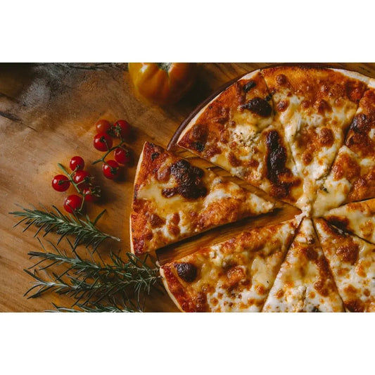A golden-brown cheesy pizza with charred spots and fresh rosemary sprigs for outdoor cooking adventure.