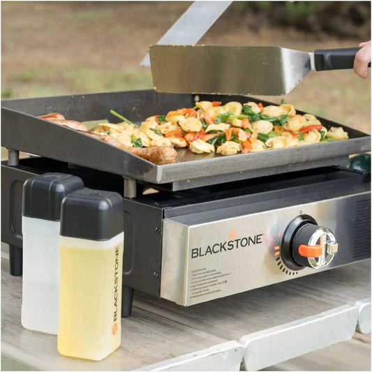 Blackstone 17 tabletop gas griddle with flat dark gray cooking surface and stainless steel accents for outdoor cooking