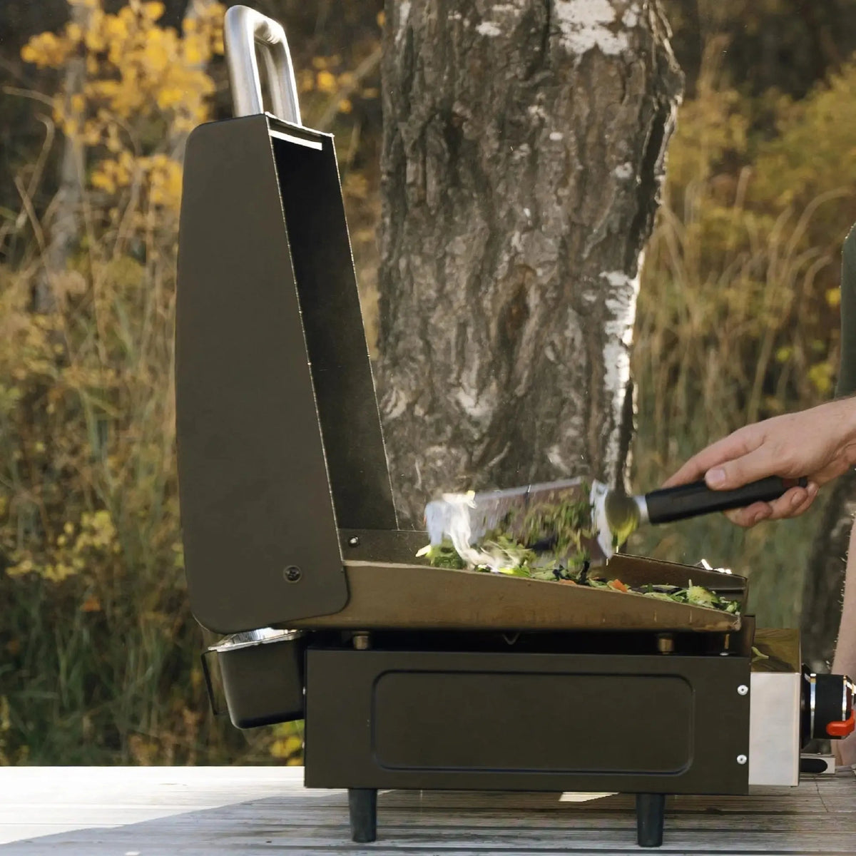 Blackstone 17 inch tabletop griddle with hood black portable gas grill with silver handle and stainless steel surface