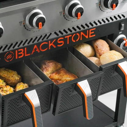 Blackstone 36 inch griddle with air fryers in black and orange featuring three compartments with roasted chicken and potatoes