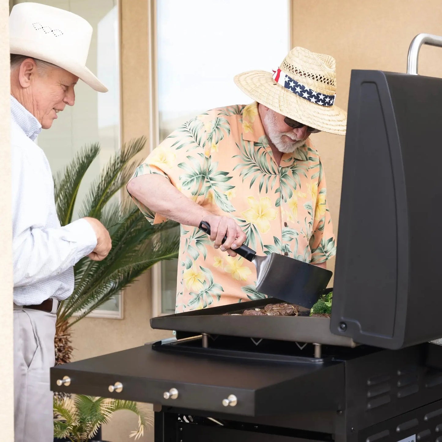 Black gas grill with stainless steel accents and side shelf featured in the blackstone 36 inch griddle with air fryers