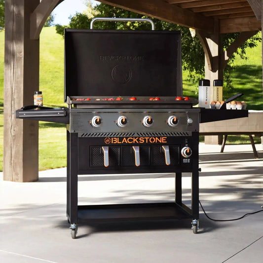 Blackstone 36 inch outdoor gas grill with black cast iron cooking surface and stainless steel accents with air fryers