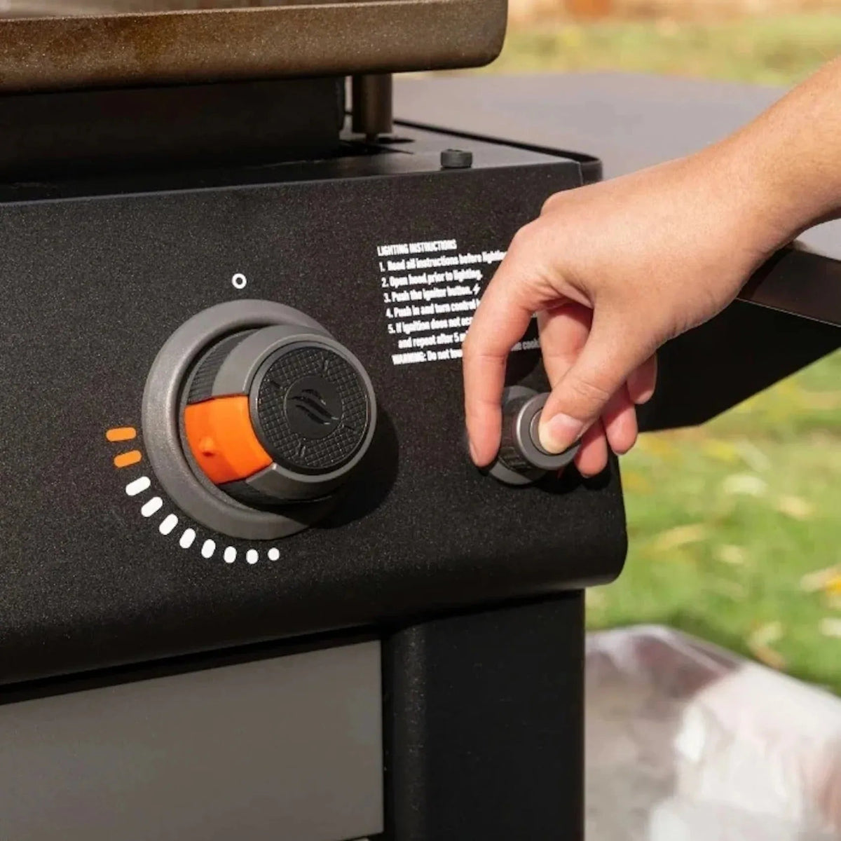 Blackstone culinary 36 inch griddle control knob in black and orange with textured gray grip for precise heat control