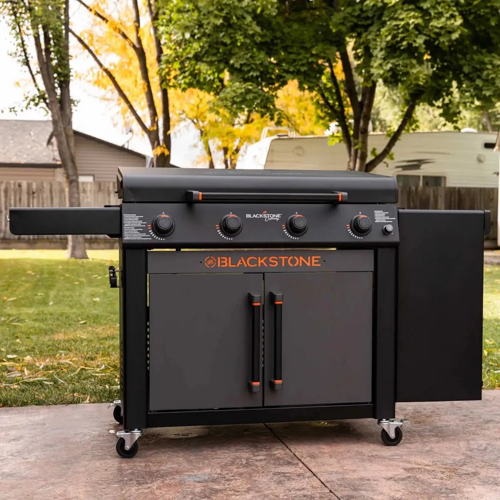 Blackstone culinary 36 inch griddle with cabinet and side table featuring sleek black finish orange logo and cast iron build