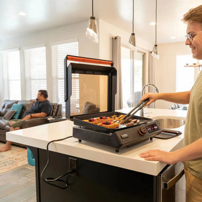 Blackstone e-series 17 inch electric tabletop griddle with black and orange design and digital temperature display