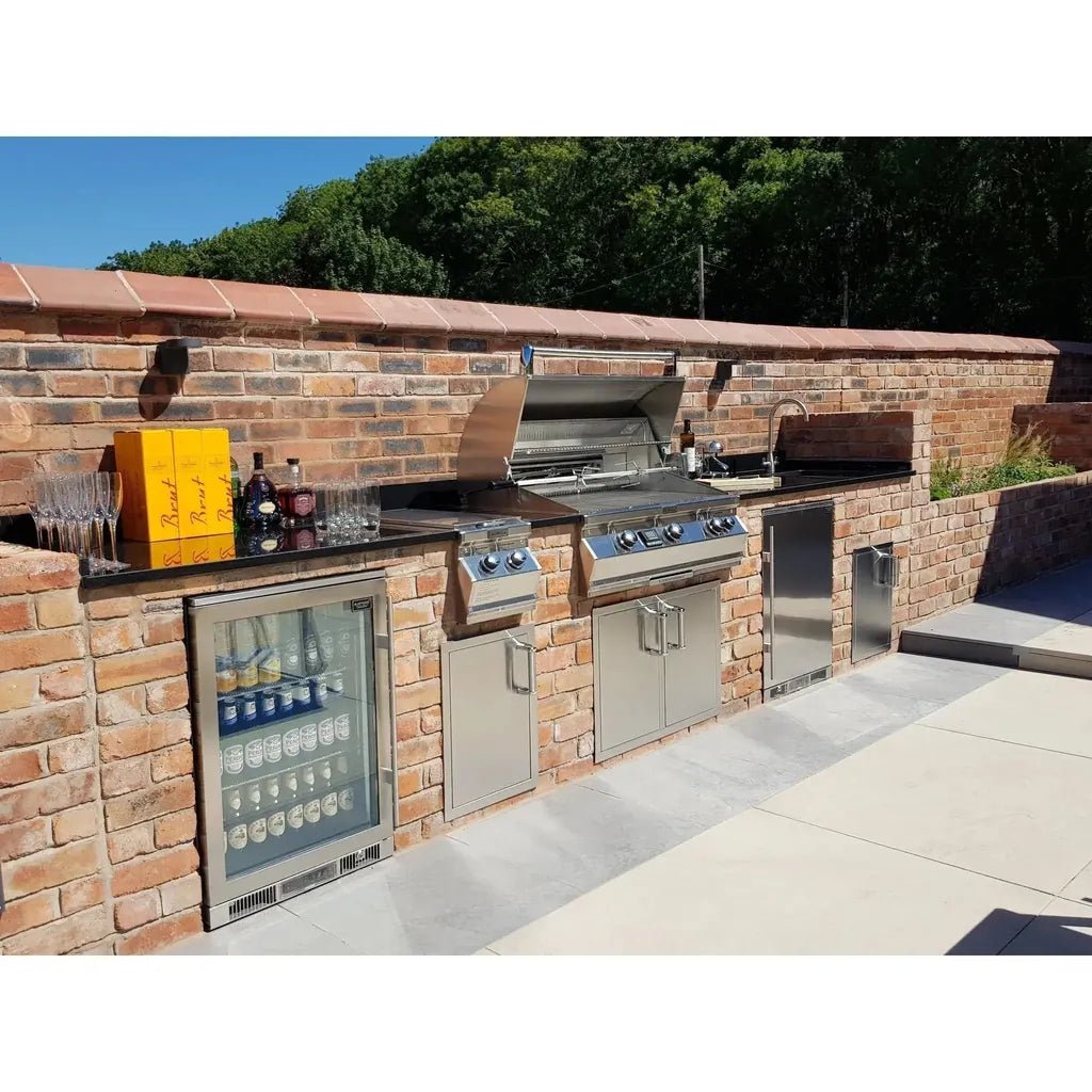 Stainless steel outdoor kitchen with built-in grill refrigerator and storage cabinets featuring blastcool extremis xp1 premium beverage fridge