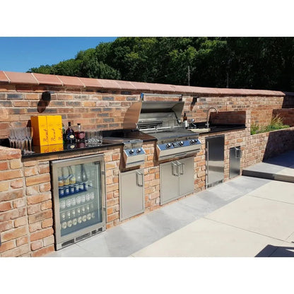 Stainless steel outdoor kitchen with built-in grill refrigerator and storage cabinets featuring blastcool extremis xp1 premium beverage fridge