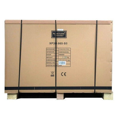 Brown cardboard shipping crate with black straps and label for blastcool extremis xp3 stainless steel triple door outdoor fridge