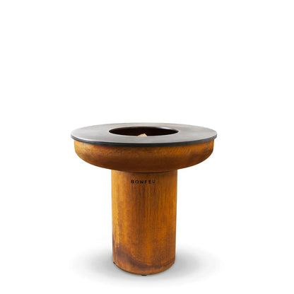 Rust-colored corten steel BonFeu BonBiza XL plancha grill and fire pit with black top and engraved brand name base