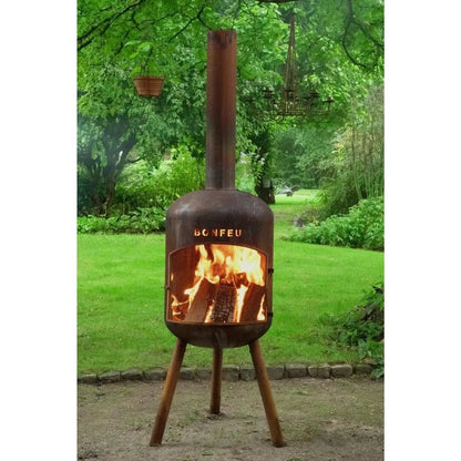 Rustic brown bonfeu bonbono large outdoor fireplace with tall chimney and tripod legs in corten steel with glowing fire