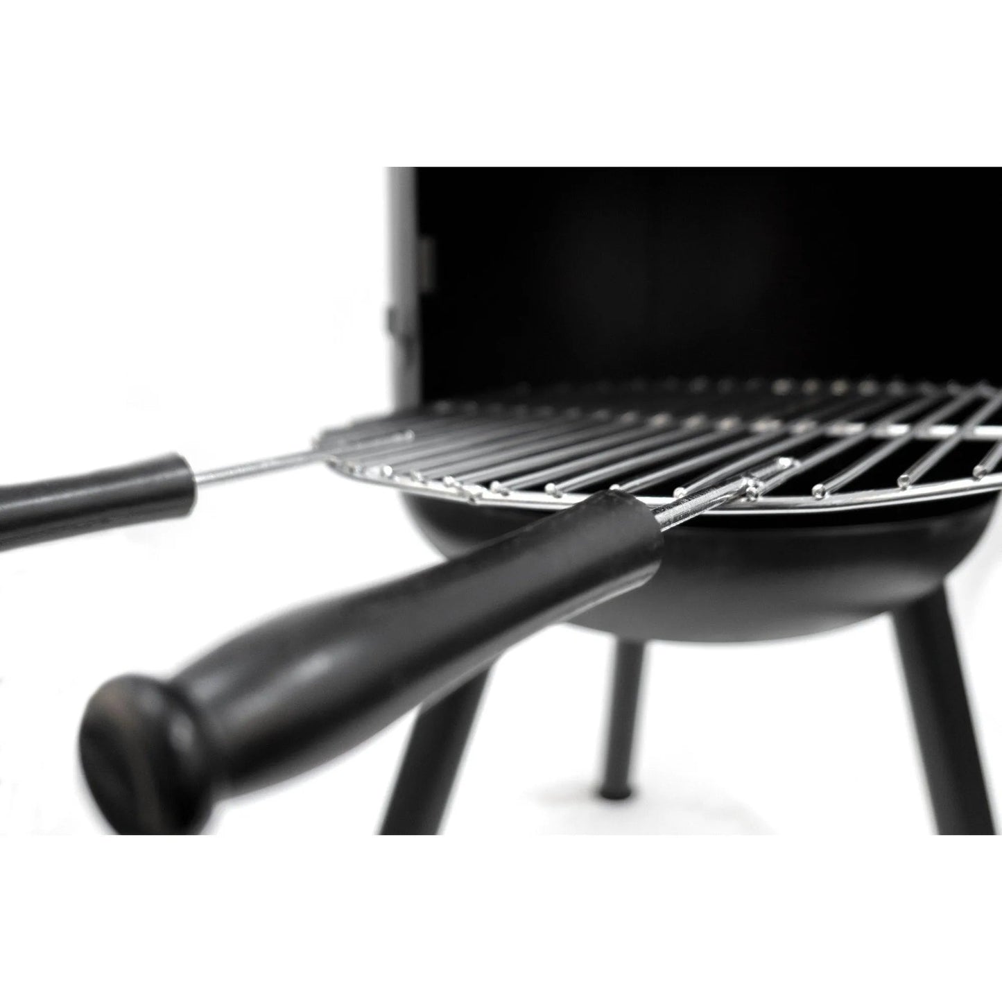 Black BonFeu BonBono large outdoor fireplace with metal grilling rack and two black-handled skewers