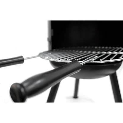 Black BonFeu BonBono large outdoor fireplace with metal grilling rack and two black-handled skewers