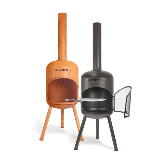 Two bonfeu bonbono large outdoor chiminea fire pits in rustic orange corten steel and matte black metal legs