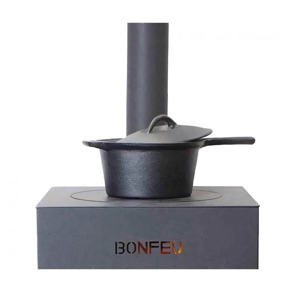 Black cast iron pot with matching lid and handle on gray stove base in bonfeu boncarré outdoor fireplace black 3503