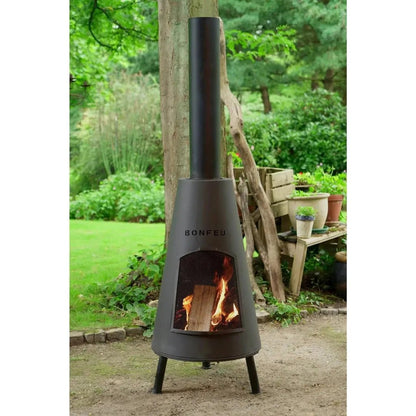 Black metal bonfeu bonpyra large outdoor chiminea with tall cylindrical chimney and fire burning inside