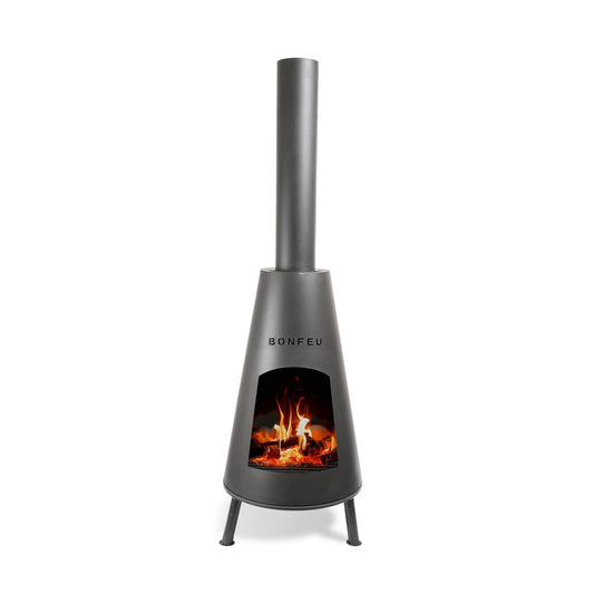 A sleek matte black BonFeu BonPyra large outdoor fireplace with tall chimney and visible flames inside