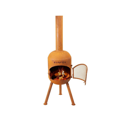 Rust-colored corten steel bonfeu bonsolo outdoor fireplace with tall chimney and mesh door for firewood burning