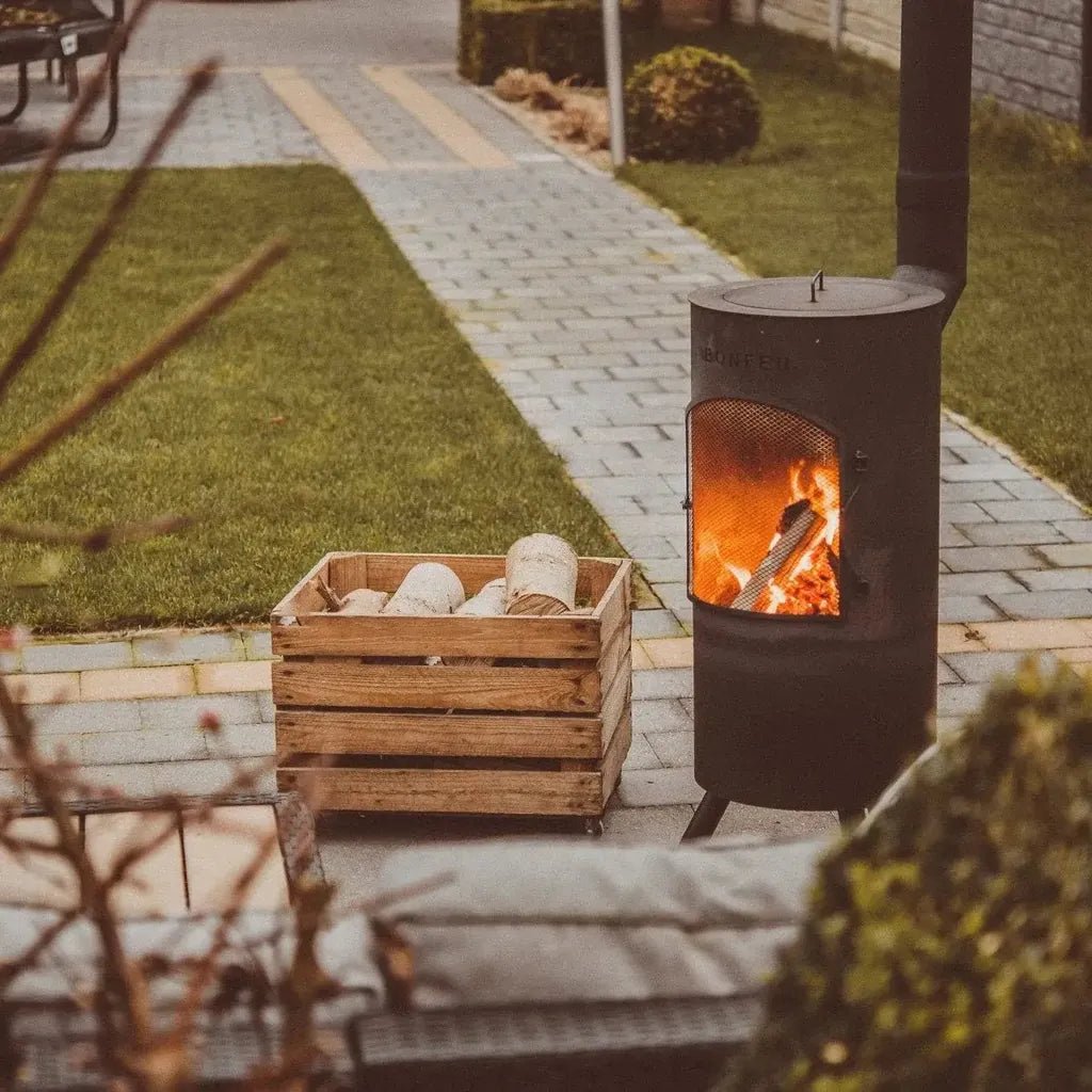 Black metal bonfeu bontino lp outdoor wood-burning stove with mesh front and visible flames inside
