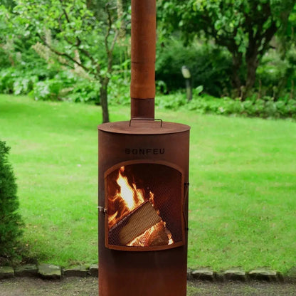 Rust-colored corten steel bonfeu bontino lp outdoor fireplace with chimney and visible flames inside