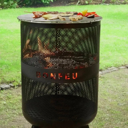 Black perforated metal bonfire grill with glowing embers cooking food on bonfeu bonves 45 fire basket