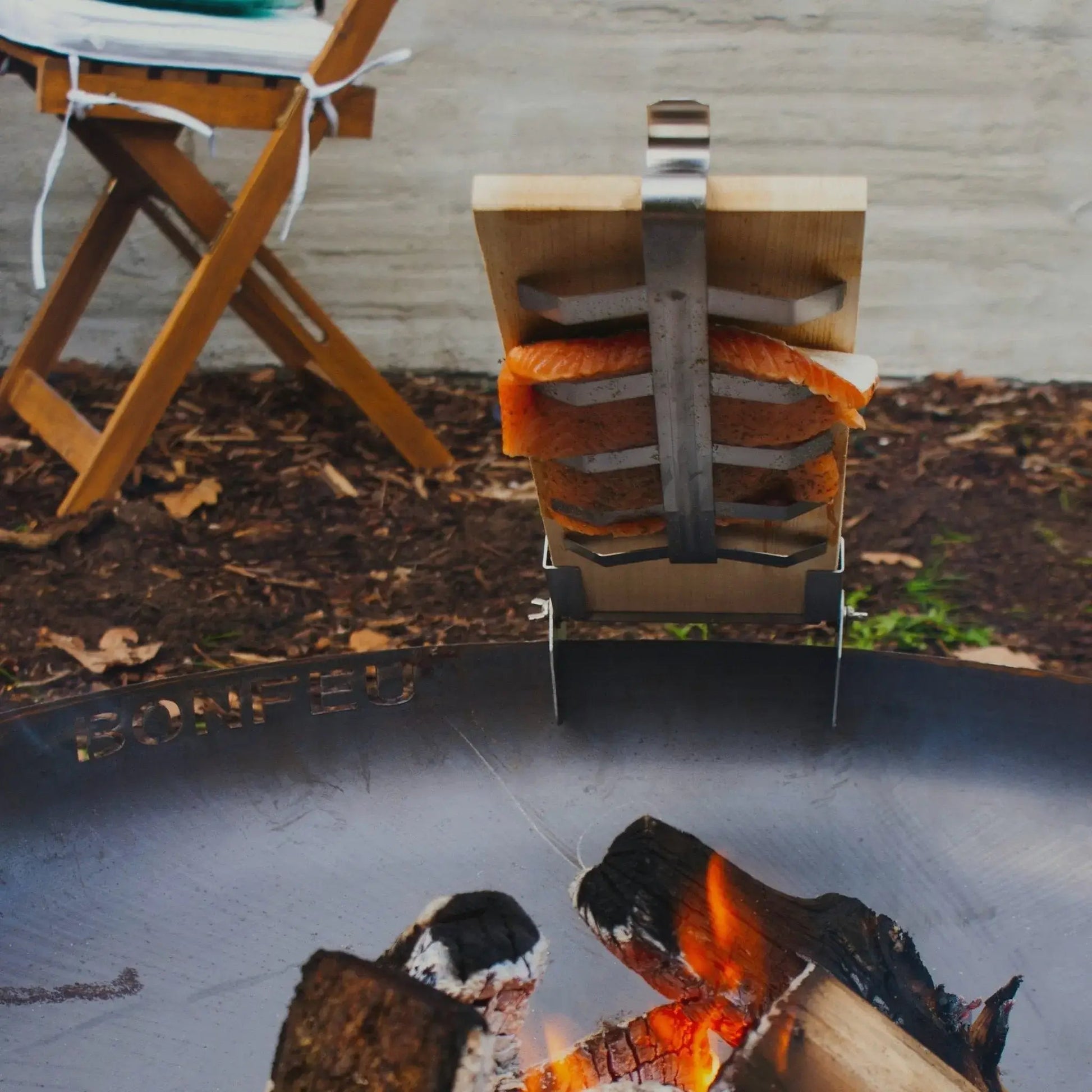 BonFeu Broiling Board to smoke meat over BonFeu fire bowls