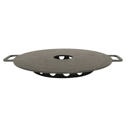 Dark gray circular cast iron grill grate with two side handles and central hole for bonfeu plancha outdoor fireplace