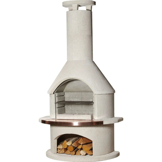 White concrete outdoor fireplace with copper metal rim and stacked logs in lower compartment from buschbeck rondo masonry barbecue