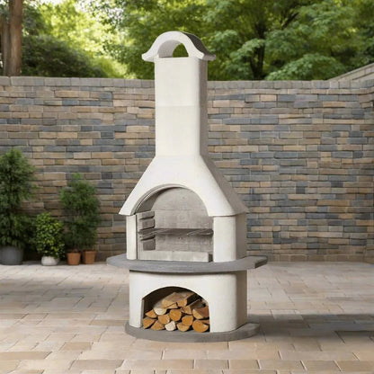 White ceramic outdoor pizza oven with chimney and wood storage compartment by Buschbeck Verona masonry barbecue