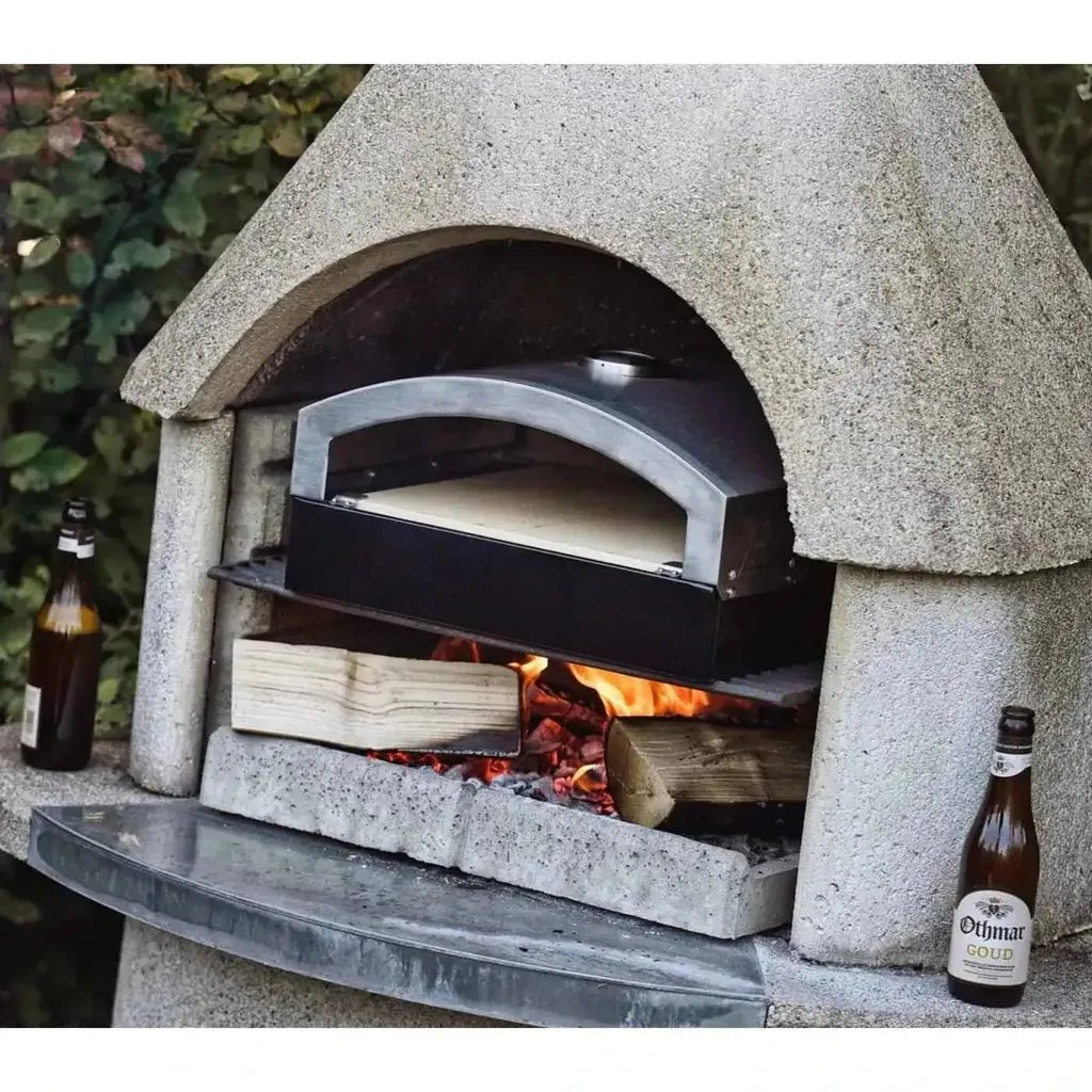 Buschbeck wellington masonry barbecue with stainless steel and black enamel pizza oven insert in gray stone oven with embers