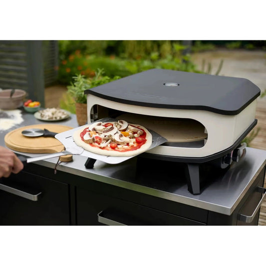 Cream-colored and black cozze 17 inch gas pizza oven with rotating stone and sleek modern electric design