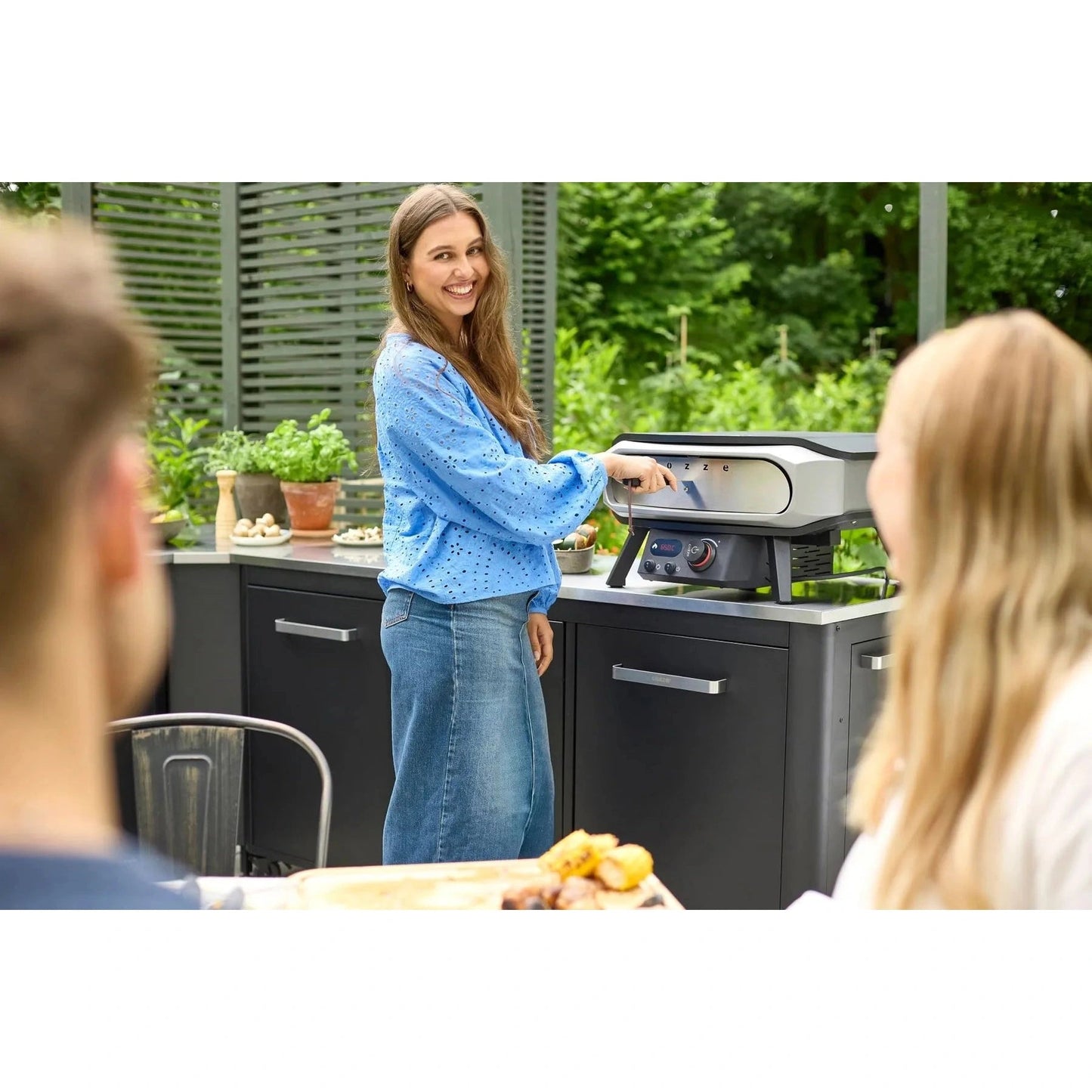 Silver and black countertop gas pizza oven with rotating stone and digital controls by cozze model 90426
