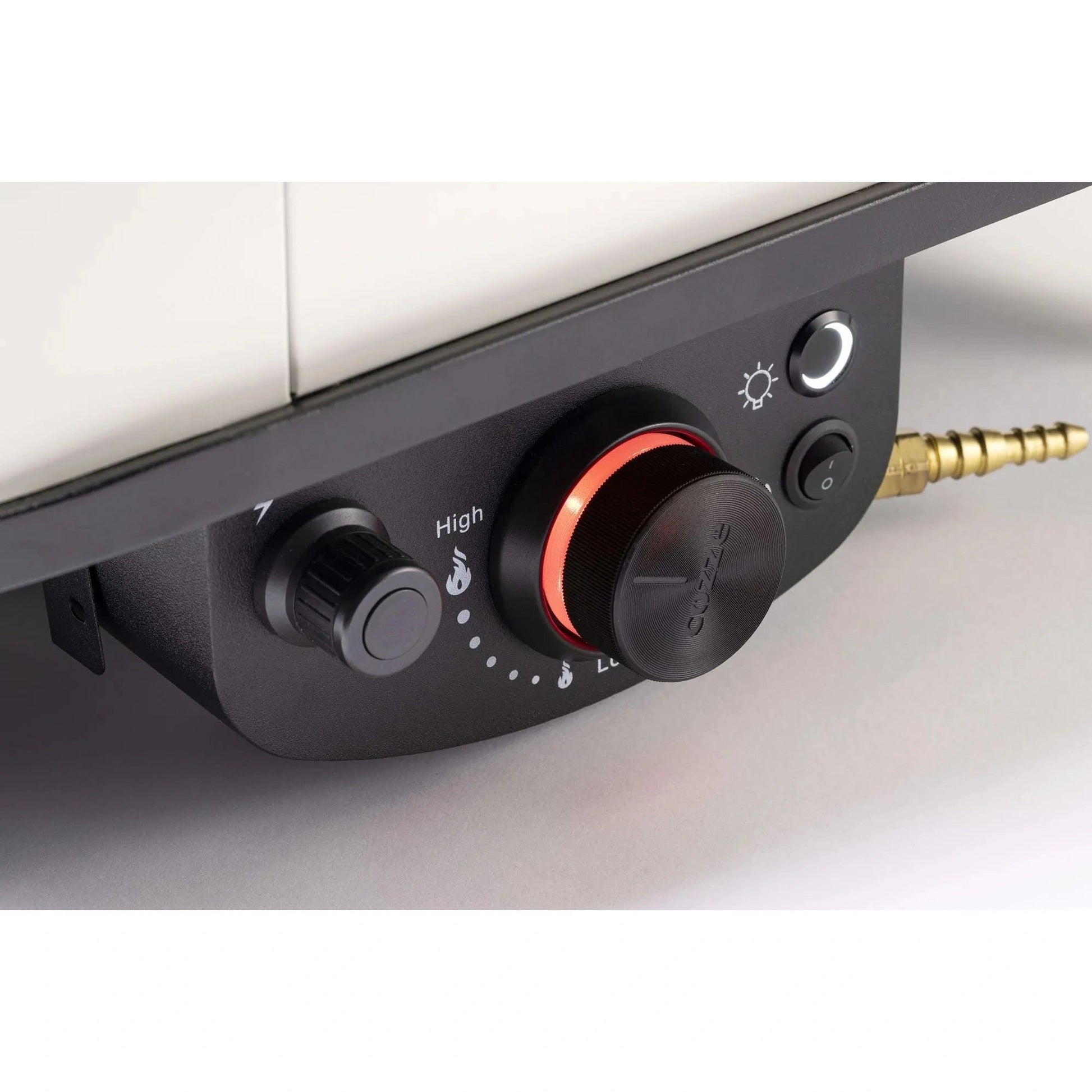 Black control panel with red knob and two black dials on cazzy branded cozze 17 inch gas pizza oven with rotating stone
