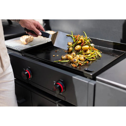 Black cast iron griddle with red accent control knobs from cozze smash and sear grill 900 grill and trolley package